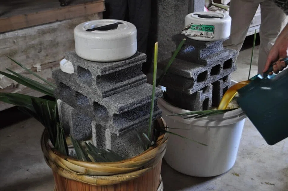 Two barrels — wooden and plastic — for the first fermentation experiment