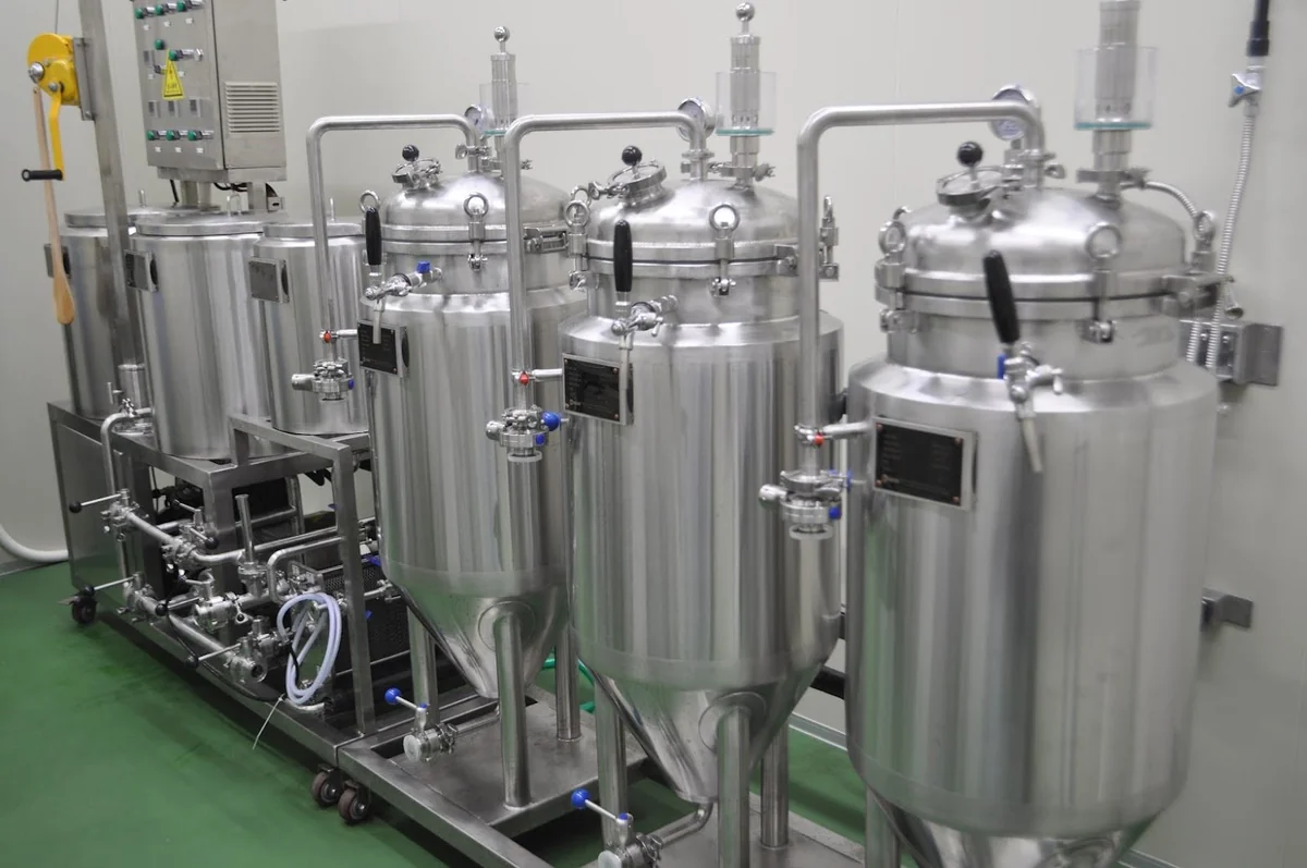 Stainless steel extraction tanks at Nagamine Seicha, Yaizu — where Bodai-Sancha is brewed into the base liquor